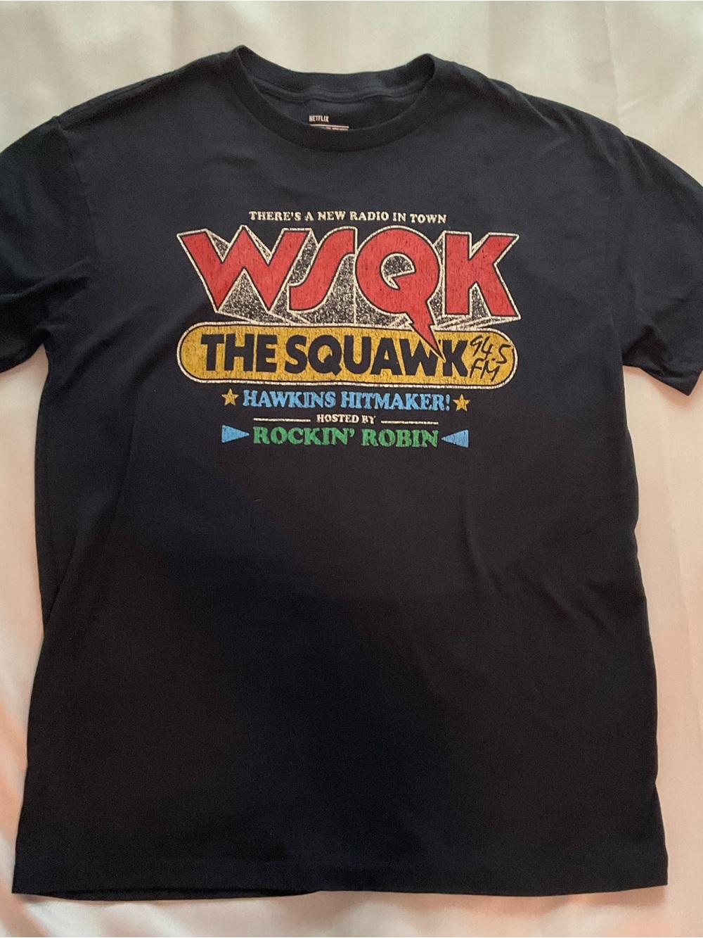 Netflix Black Graphic Tee with Red Yellow Green and Blue Logo